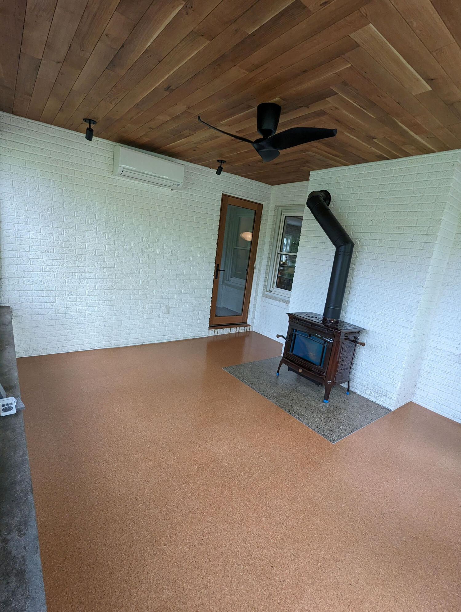 White oak ceiling, cork flooring, polished concrete hearth